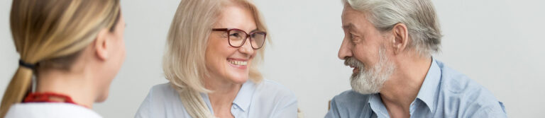 A couple discussing with dentist