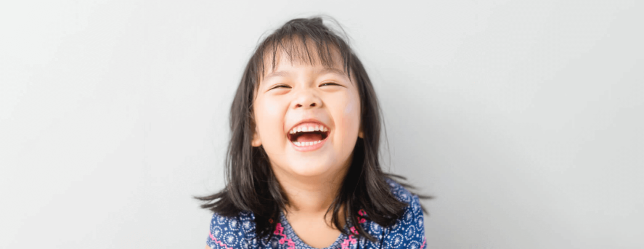 A cute little girl laughing