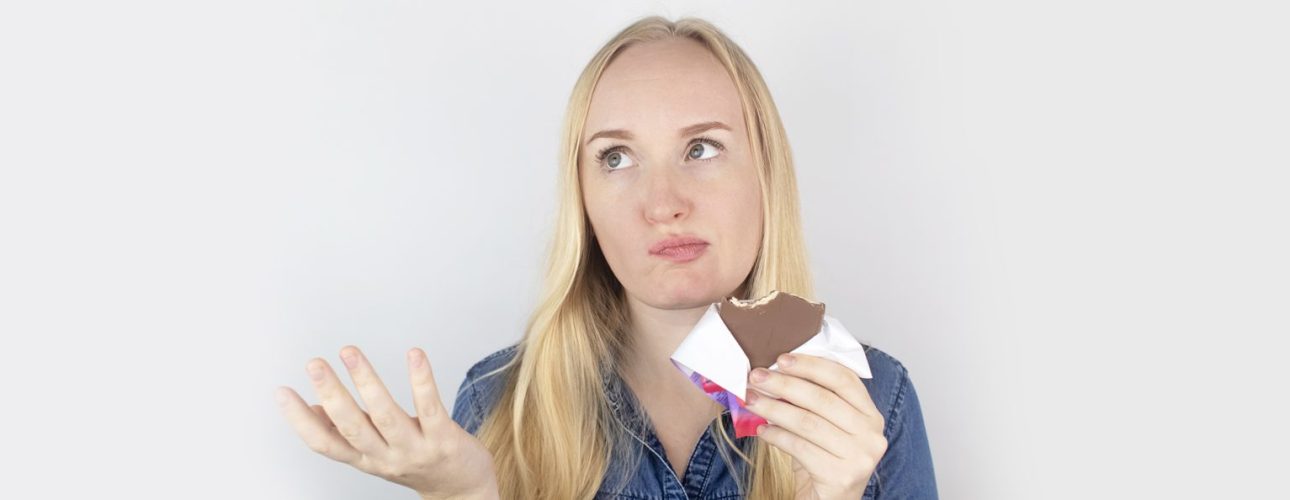 A girl eating dark chocolate
