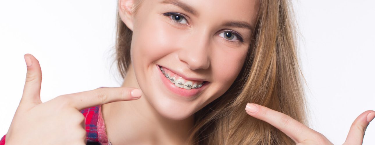 girl with traditional braces