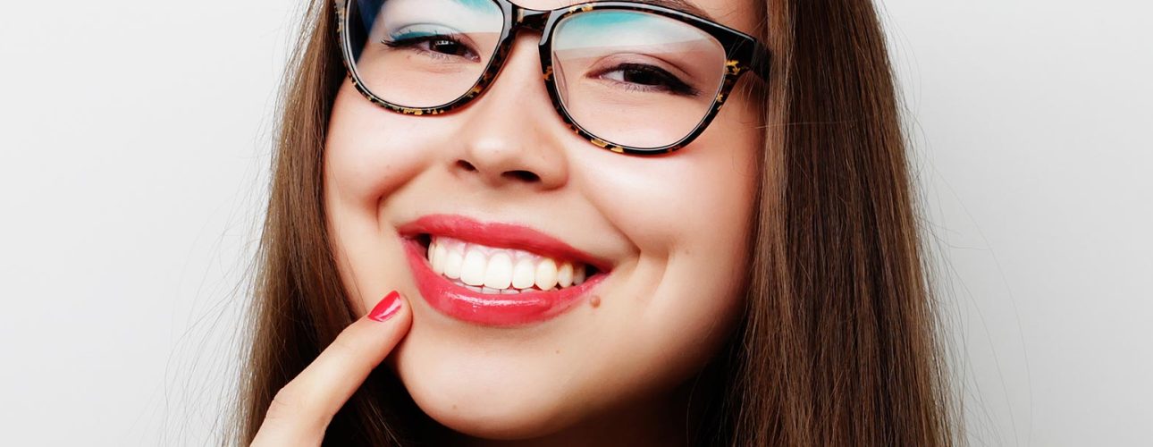 A smiling lady wearing glasses