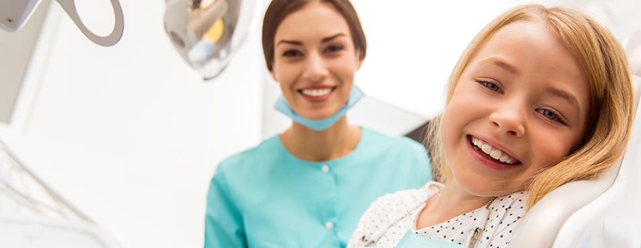 A little girl with a dentist